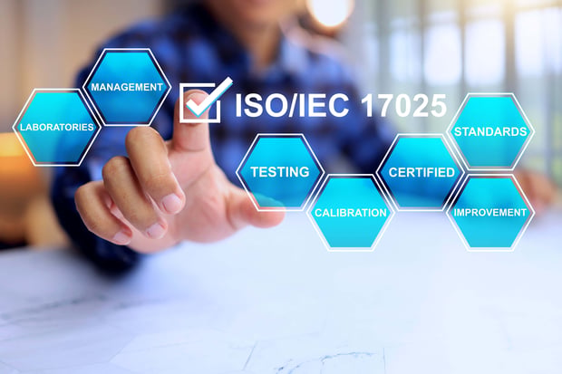 Person selecting ISO/IEC 17025 certification on a digital interface with laboratory, testing, calibration, and standards icons.
