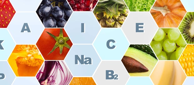 Vitamins and minerals in fruits and vegetables on background.