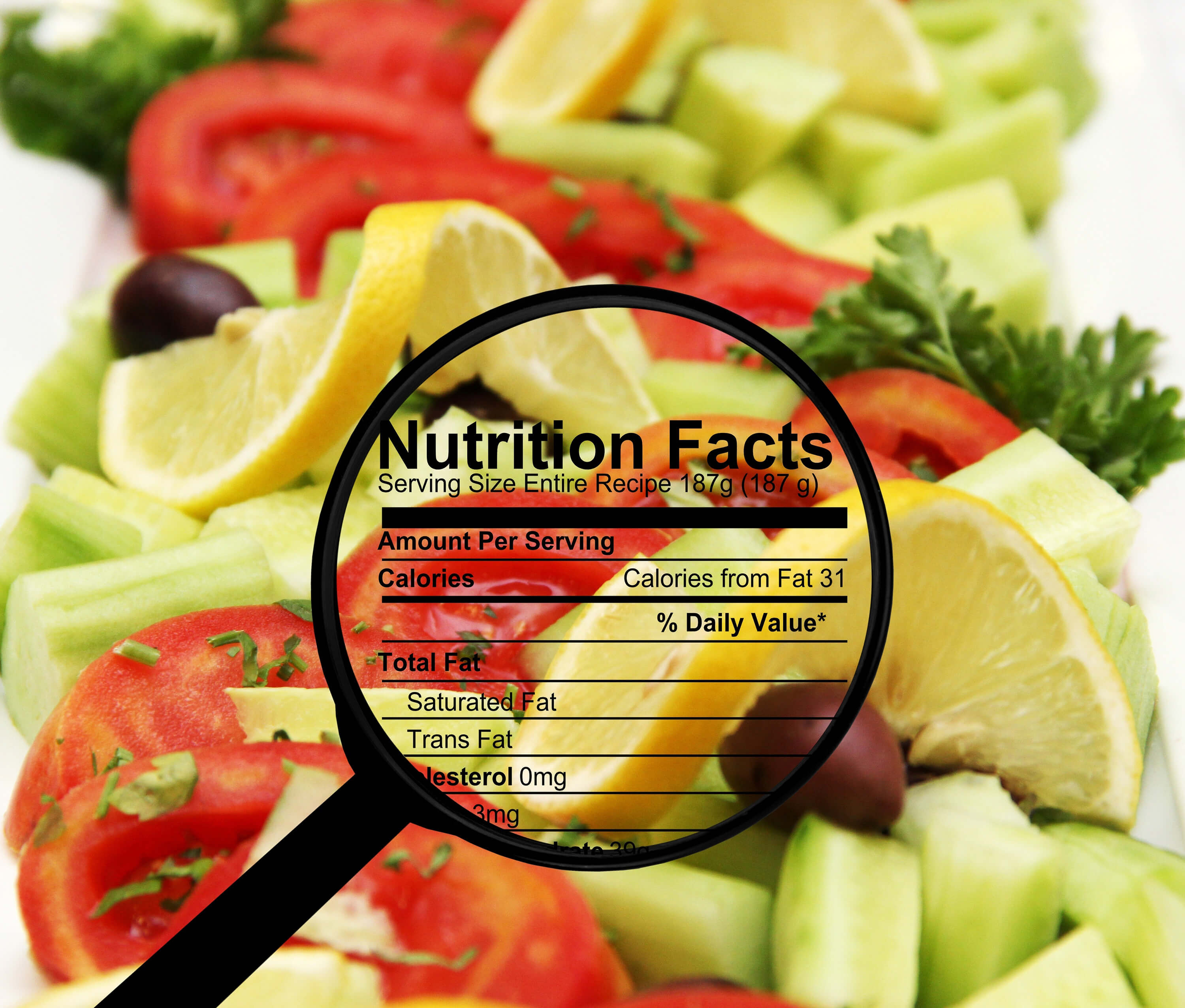 Nutrition facts label over fresh salad ingredients.