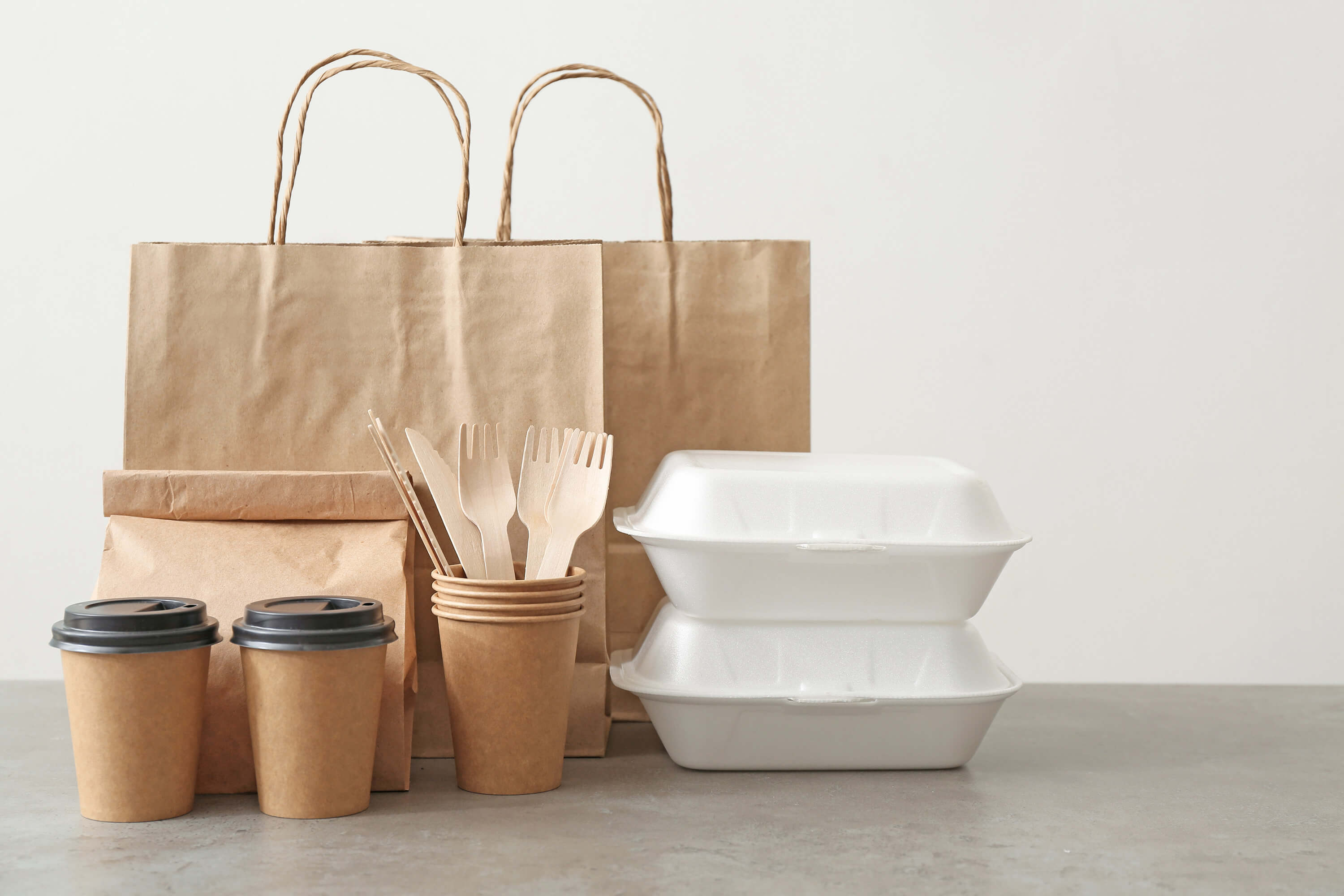 Assortment of food delivery containers on table.