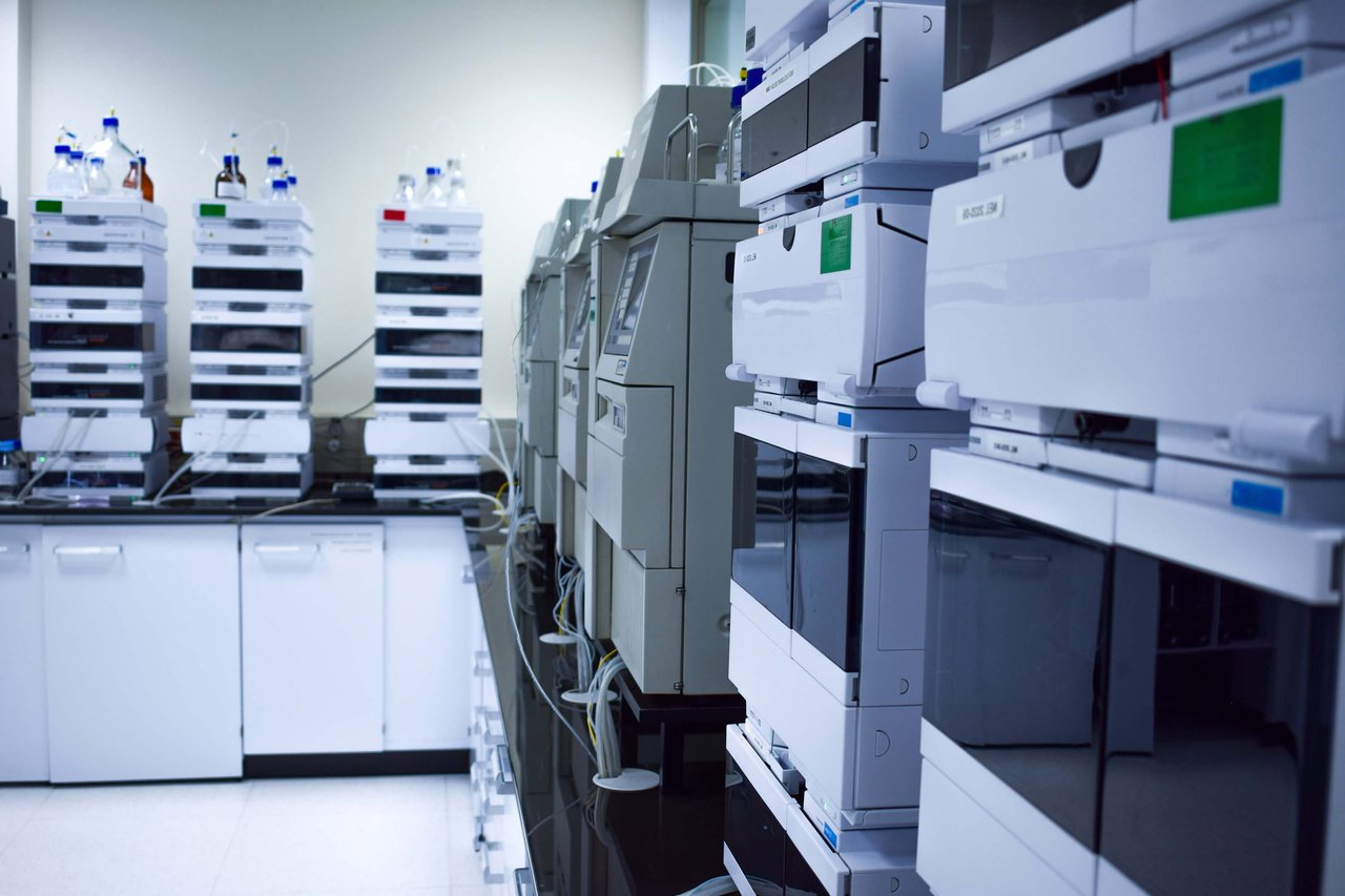 A laboratory filled with various types of scientific equipment, including beakers, microscopes, and test tubes.