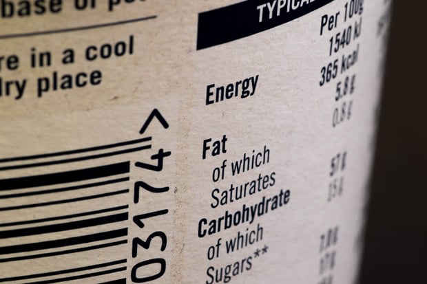 Fat content information displayed on food packaging label with shallow depth of field.