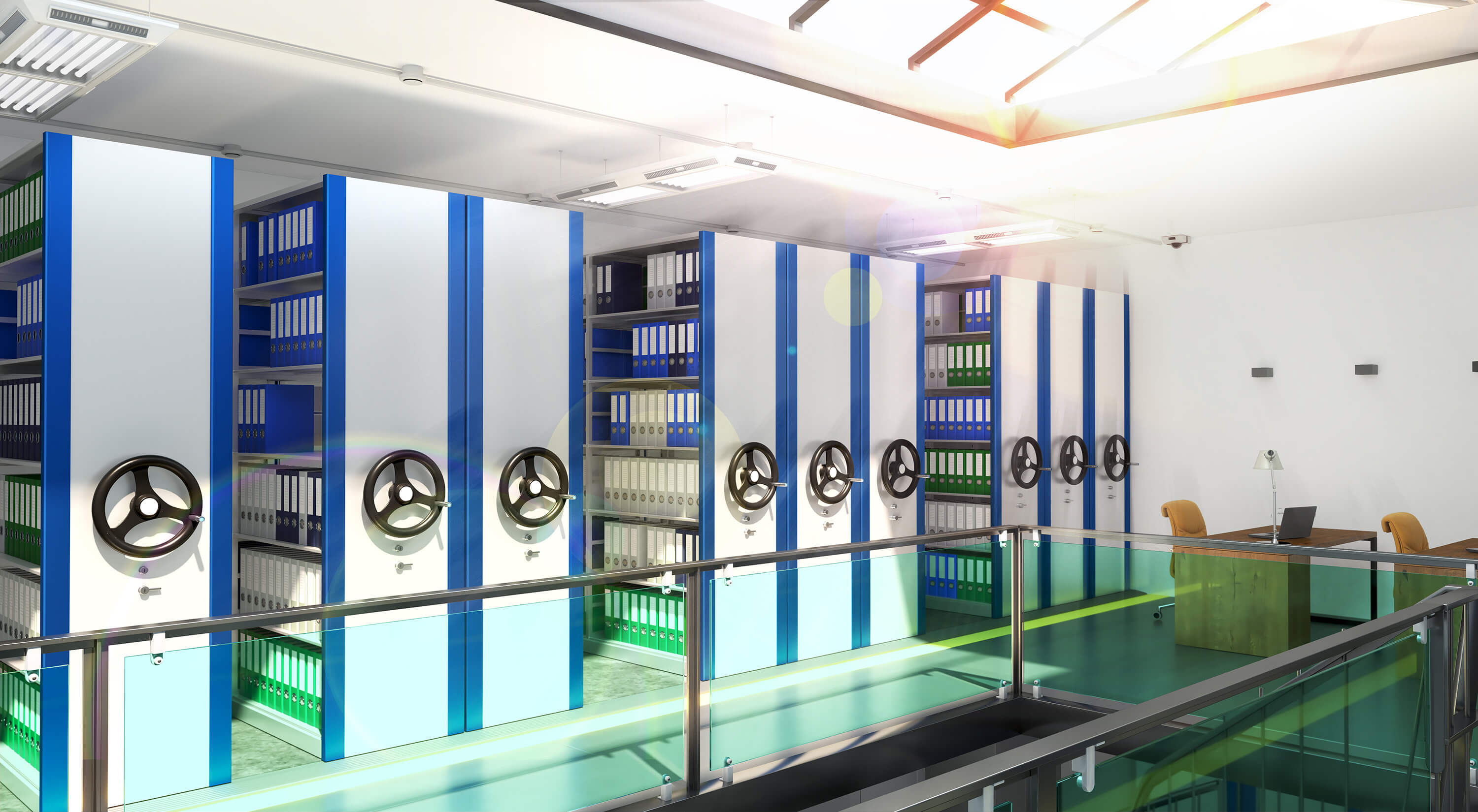 Modern archive room with mobile shelving units filled with document binders.