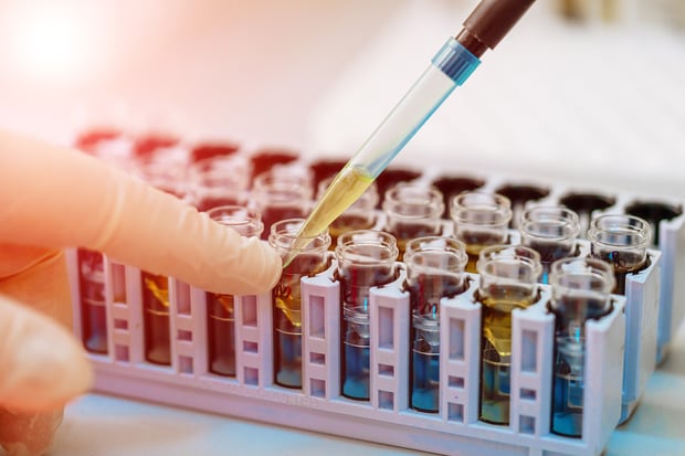 Scientist working with bioanalytical samples in laboratory.